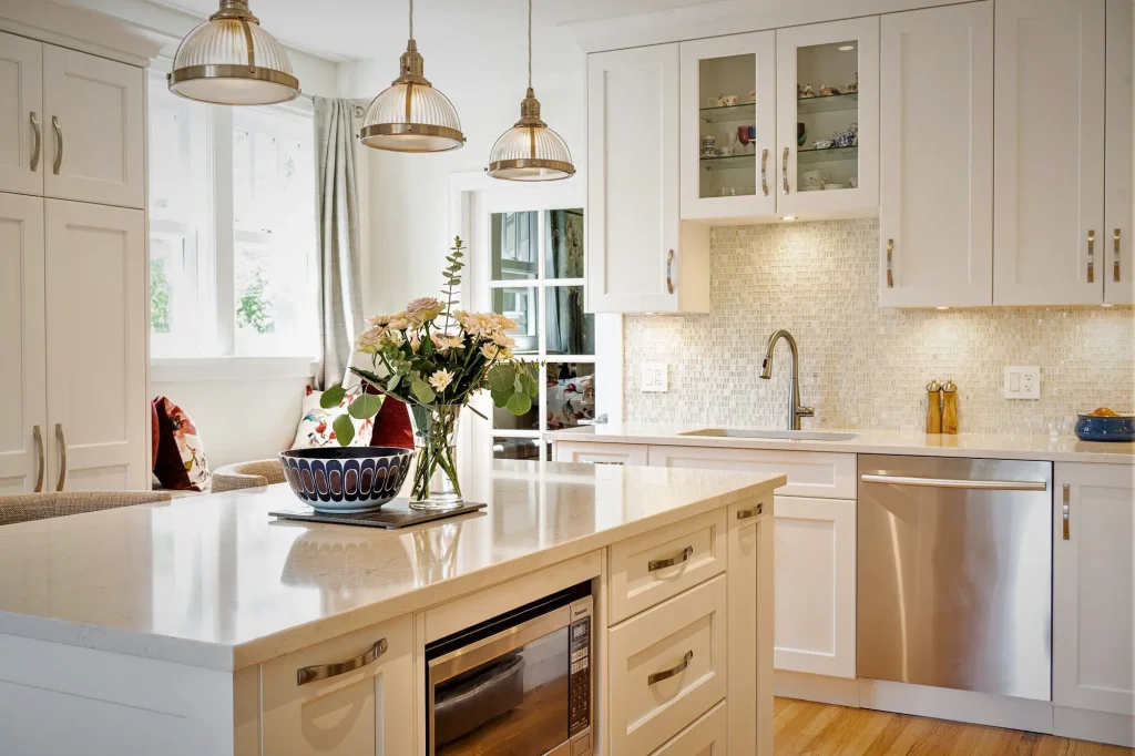Modern kitchen with white cabinets and floral decor