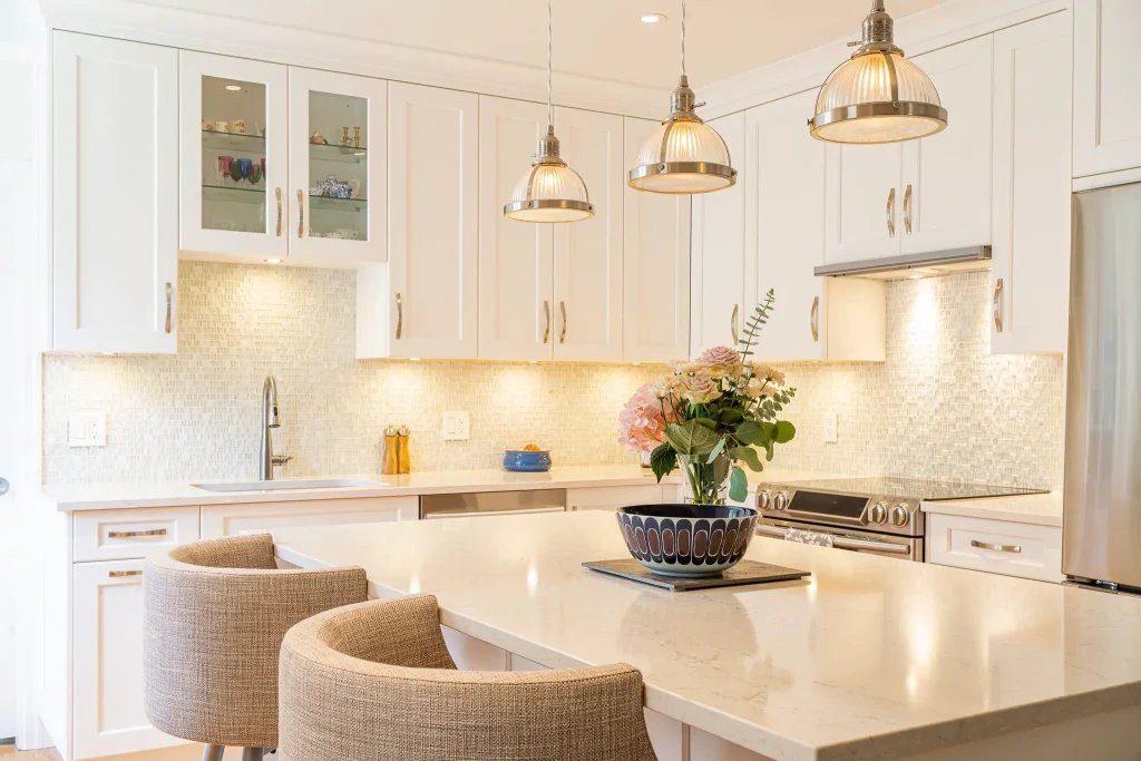 Bright modern kitchen with island and flowers.